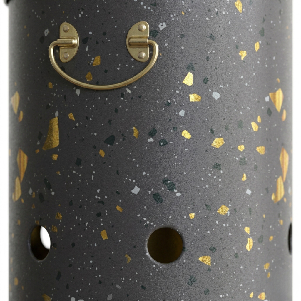 Dark cylindrical container with gold speckles and a gold handle on a white background

