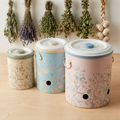 MARIA ROMA Botanica 3-piece metal vegetable storage bin set for potatoes, onions, and garlic with floral patterns on a white background